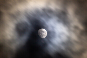 Full moon in the dark night sky with clouds,  © ric