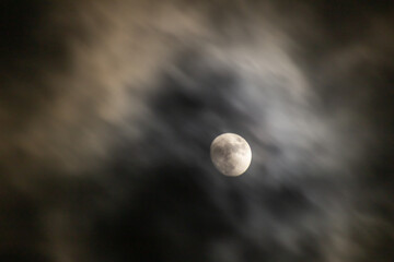 Full moon in the dark night sky with clouds,  © ric