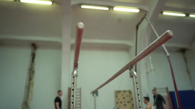Trending Parallel Bars Gymnastics Equipment Athlete Training Sports Gym Exercise in 4K Ultra HD footage.
