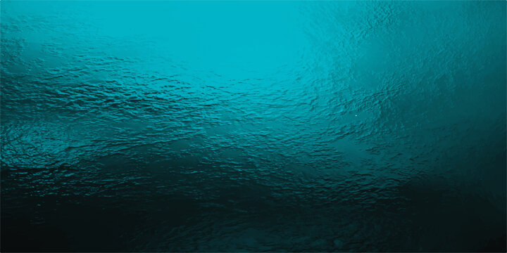 Deep blue underwater ocean scene with sunlight filtering through the surface and rising bubbles in calm marine water