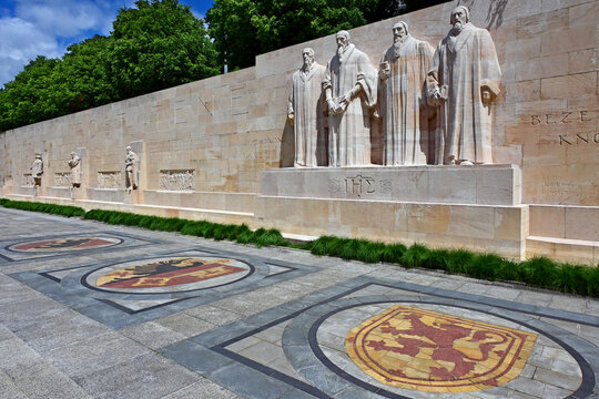 Geneva, Switzerland, Europe - 05.2026 : Prominent reformers statues - Jean Calvin, Guillaume Farel, Th&eacute;odore de Beze and John Knox, reformation wall in Bastions park, Swiss towns coats of arms 