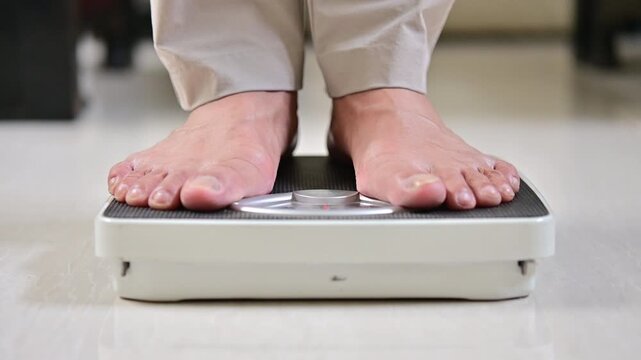 This is a man that doing morning routine weight monitor