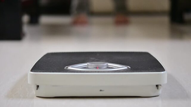 This is a man that doing morning routine weight monitor