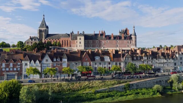Aerial footage capturing the iconic Chateau de Gien and the charming historic town center of Gien, France. The video showcases the castle s impressive architecture, traditional French townhouses