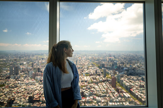 Woman looking over Taipei from observation deck