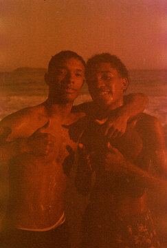 Cousins Embrace at Shore in Brazil
