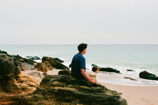 Travel Adventure: Dad and Toddler on Rocky Beach