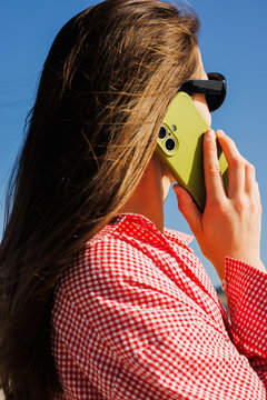Businesswoman in Sunglasses Using Smartphone Outdoors