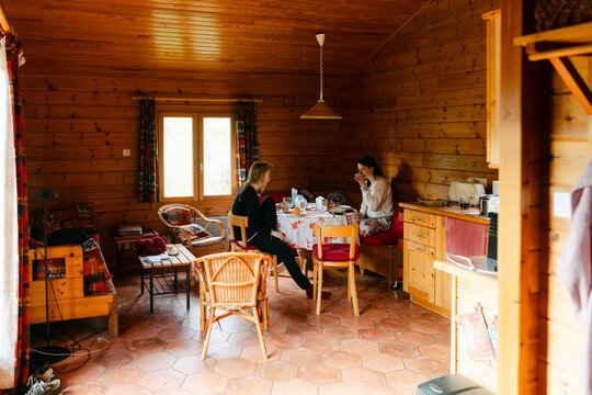 two young women, sisters, having breakfast