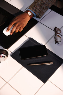 Business Workspace With Hand on Mouse 