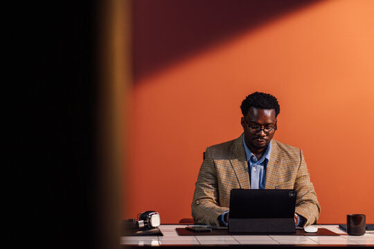 Man Working on Tablet 