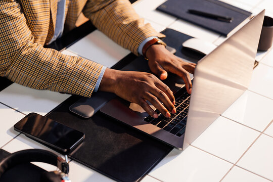 Businessman Typing on Laptop