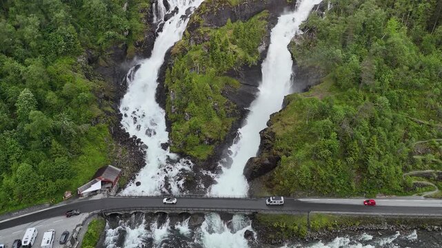 Aerial drone vertical reveal of Latefossen with highway, Norway