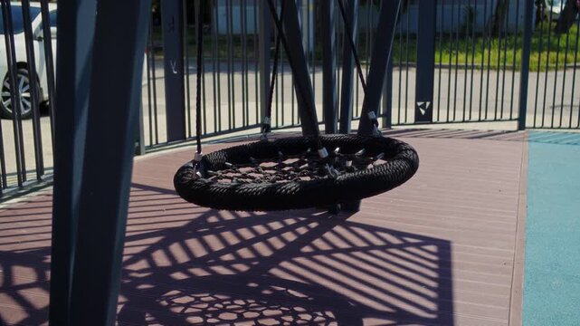 Close up of nest swing on modern playground