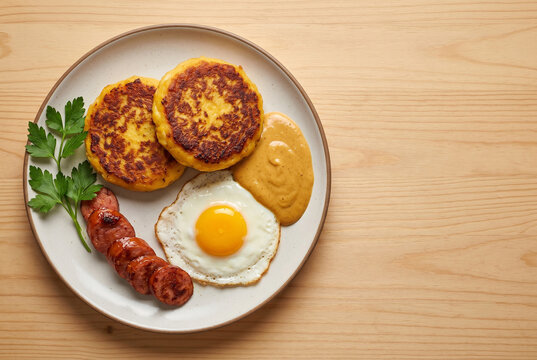 Llapingachos - Ecuadorian Potato Cakes with Chorizo and Fried Egg &ndash; With Copy Space