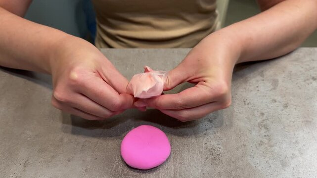 Middle sequence of hands demonstrating peeling of pink cosmetic sponge to reveal pliable foam
