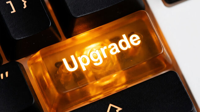 Glowing amber 'upgrade' key on black keyboard