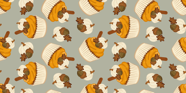 Cozy fall pattern featuring sweet muffins decorated with orange frosting, cinnamon sticks, star anise, acorns and small white pumpkins on a muted grey backdrop. Ideal for Thanksgiving.
