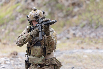 Fototapeta premium Military participate in a patrol in a rocky terrain