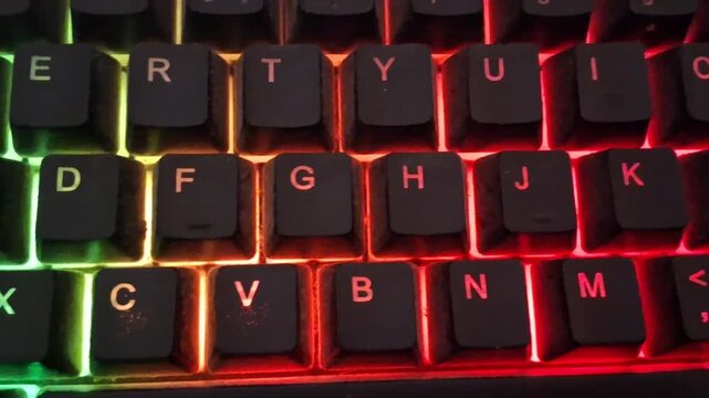 Gaming keyboard with vibrant neon red backlight motion video clip