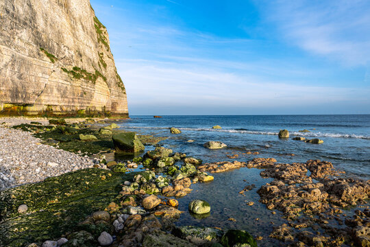 Natural beauty of Yport near &Eacute;tretat with towering white cliffs and a scenic beach along the famous Normandy coast of France.