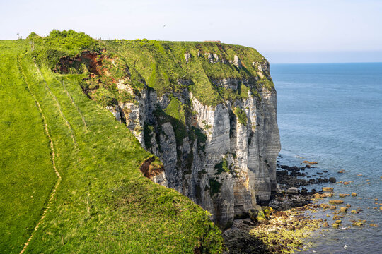 Natural beauty of Yport near &Eacute;tretat with towering white cliffs and a scenic beach along the famous Normandy coast of France.