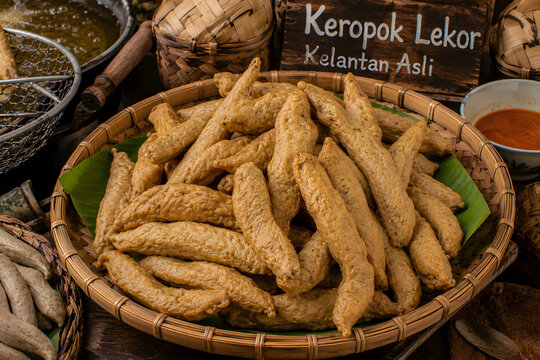 Keropok Lekor Kelantan Asli is a traditional handmade fish cracker, fried until golden brown and enjoyed as a popular Malaysian street snack.