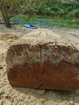 A photo of a bright SUP board against a beautiful background. Paddle board.