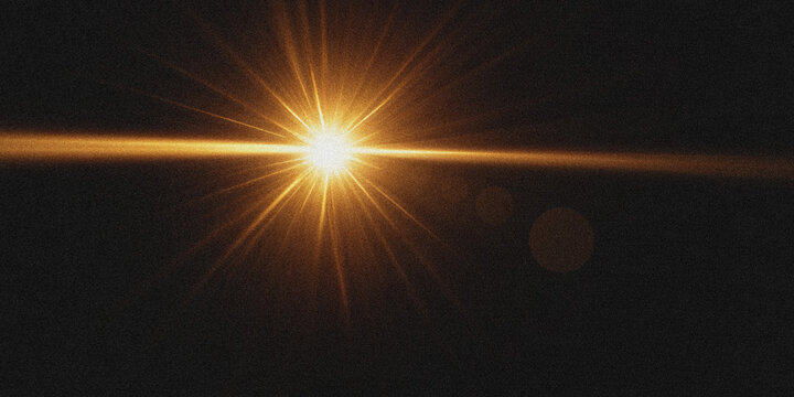 Golden light flare with horizontal lens flare on a dark background glow starburst sunbeam radiance