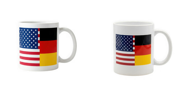 Two white coffee mugs with american and german split flag design, isolated on transparent background