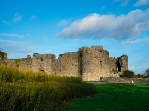 Stunning old fortress castle in Roscommon town, Ireland. Famous tourist attraction with nice green park and amazing view. Powerful stone wall and towers to protect important people. Irish history.