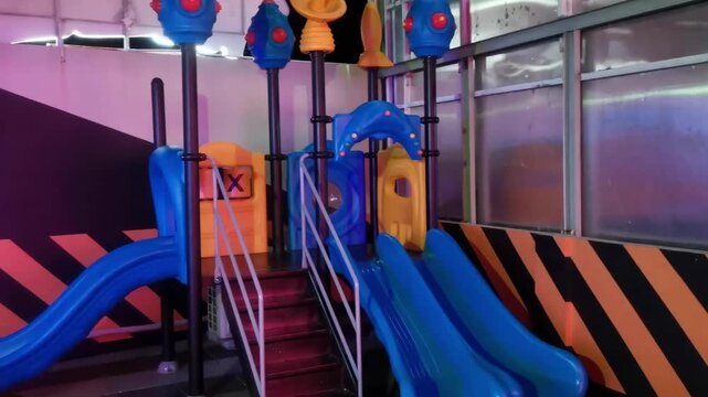Modern Indoor Playground with Blue Slides and Climbing Structure