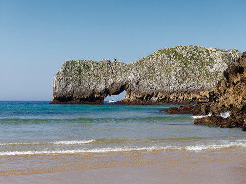 Berell&iacute;n Beach and natural rock arch on the coast of Cantabria, Spain