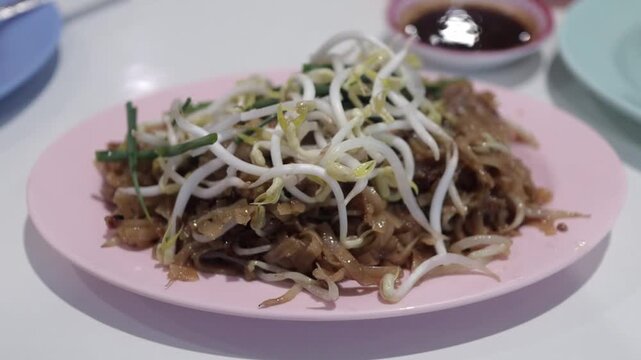 Thai Style Stir Fried Pad Thai with Bean Sprouts. Fresh Cooked, Hot Pad Mee Korat Noodles In Isaan Street Food Restaurant