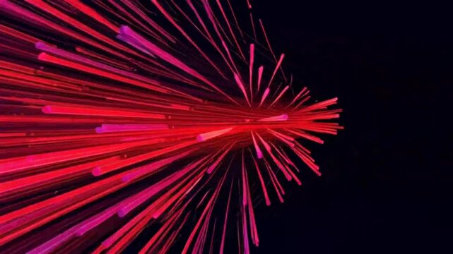 Vibrant pink and red fireworks explode in the night sky with dynamic streaks.