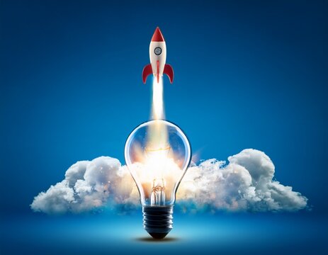 creative rocket light bulb with blast and smoke ascending against a blue background concept successful launch and growth inventive idea think differently