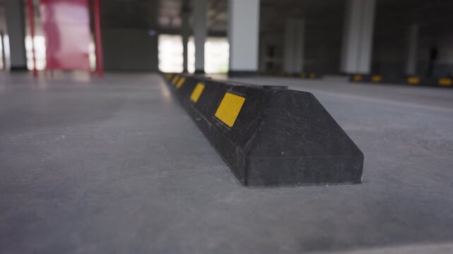 Parking wheel stop in underground parking garage