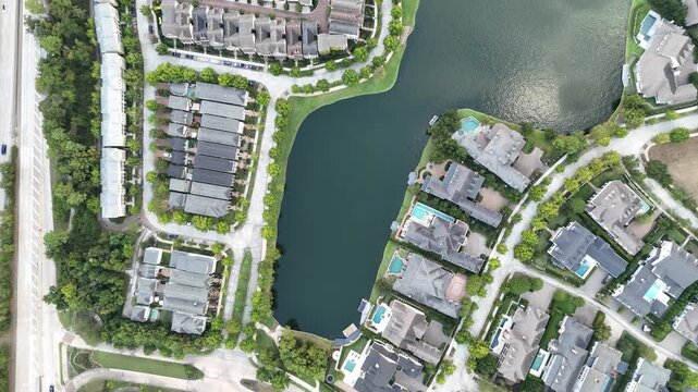 Aerial view of luxury houses and villas with swimming pools	
