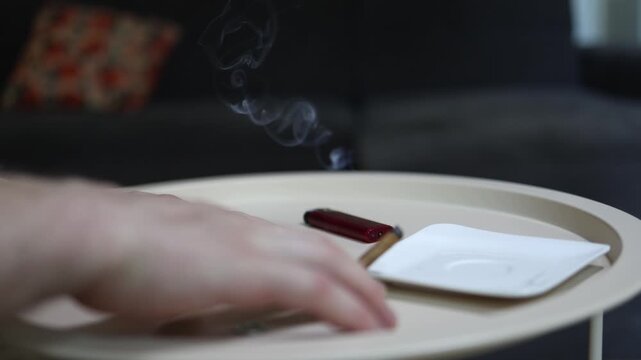 Person smoking while checking a lottery scratch card highlighting gambling addiction unhealthy habits financial hope and the pursuit of an instant jackpot
