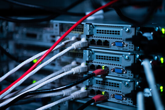 View of network cables connected to server rack ports in a data center in Los Angeles, California, United States.