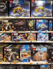 Obraz premium Dubai, UAE - May 26, 2026: Selection of LEGO Star Wars construction sets displayed in toy store. Licensed products combine creative building experience with popular entertainment brands