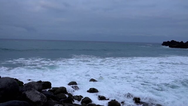 Powerful Pacific Ocean waves crashing against rocky coastline, dramatic sea surf and white foam on coastal rocks, natural seascape in Peru, 4K video