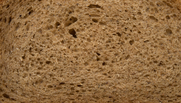 Brown slice of bread close up texture background