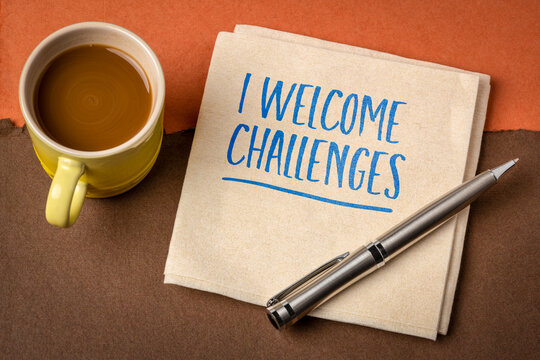 I Welcome Challenges &ndash; positive affirmation handwritten on a napkin, symbolizing courage, resilience, confidence, personal growth, and a success mindset.