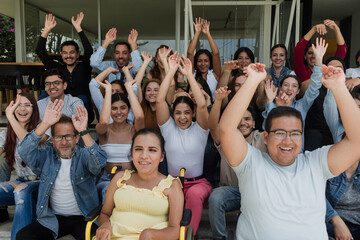 Fototapeta premium Diverse group of latin people applauding after successful conference in convention center in Mexico in Latin America, hispanic friends clapping in social meeting
