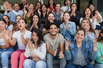 Fototapeta premium Diverse group of latin people applauding after successful conference in convention center in Mexico in Latin America, hispanic friends clapping in social meeting
