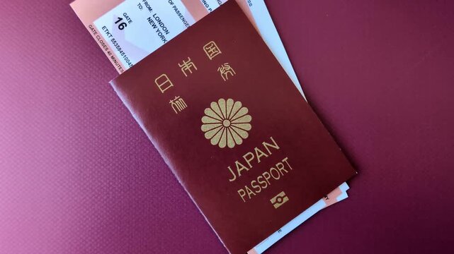Japanese passport or id document with tickets for flight, travel, border crossing. Japan passport and tickets as a background for your design