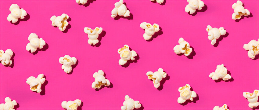 Playful arrangement of popped corn, also known as corn puffs or snack bites, floating a bright magenta surface. These crunchy morsels create a rhythmic of white snacks.