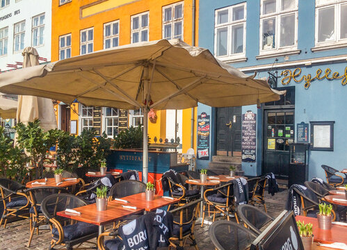 Colorful Historic Houses and Cobblestone Street in Copenhagen, Denmark