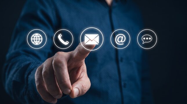 Business professional touching digital contact icons for communication methods in modern technology environment
